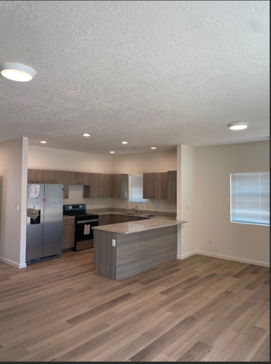 Finished kitchen with recessed lighting and modern fixtures