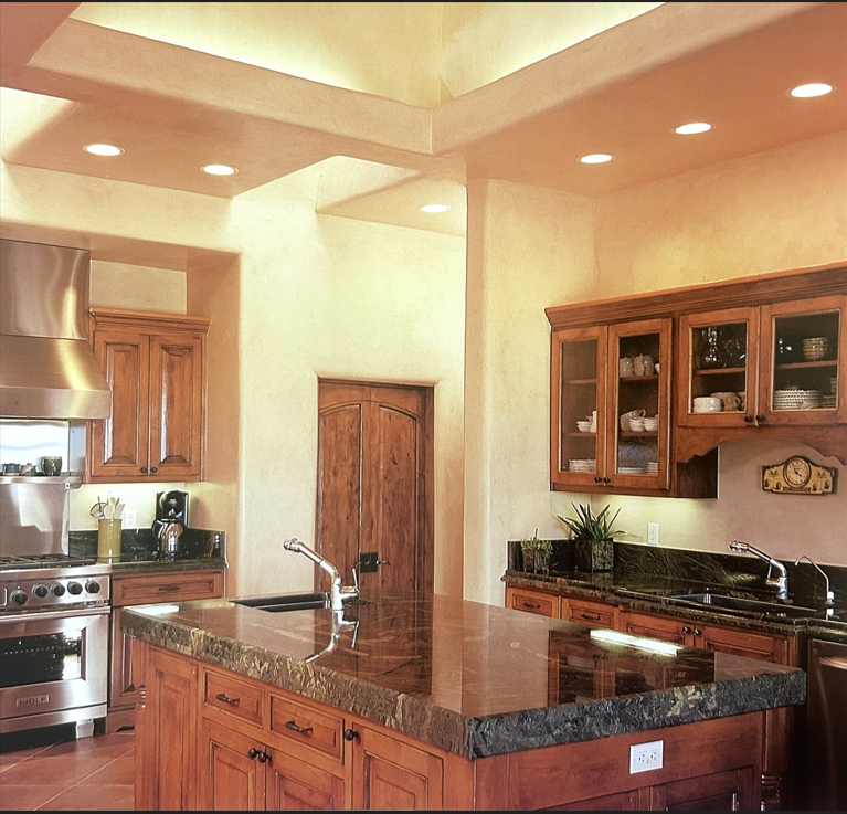 Luxury kitchen with recessed ceiling lighting, granite countertops, and warm wood cabinetry